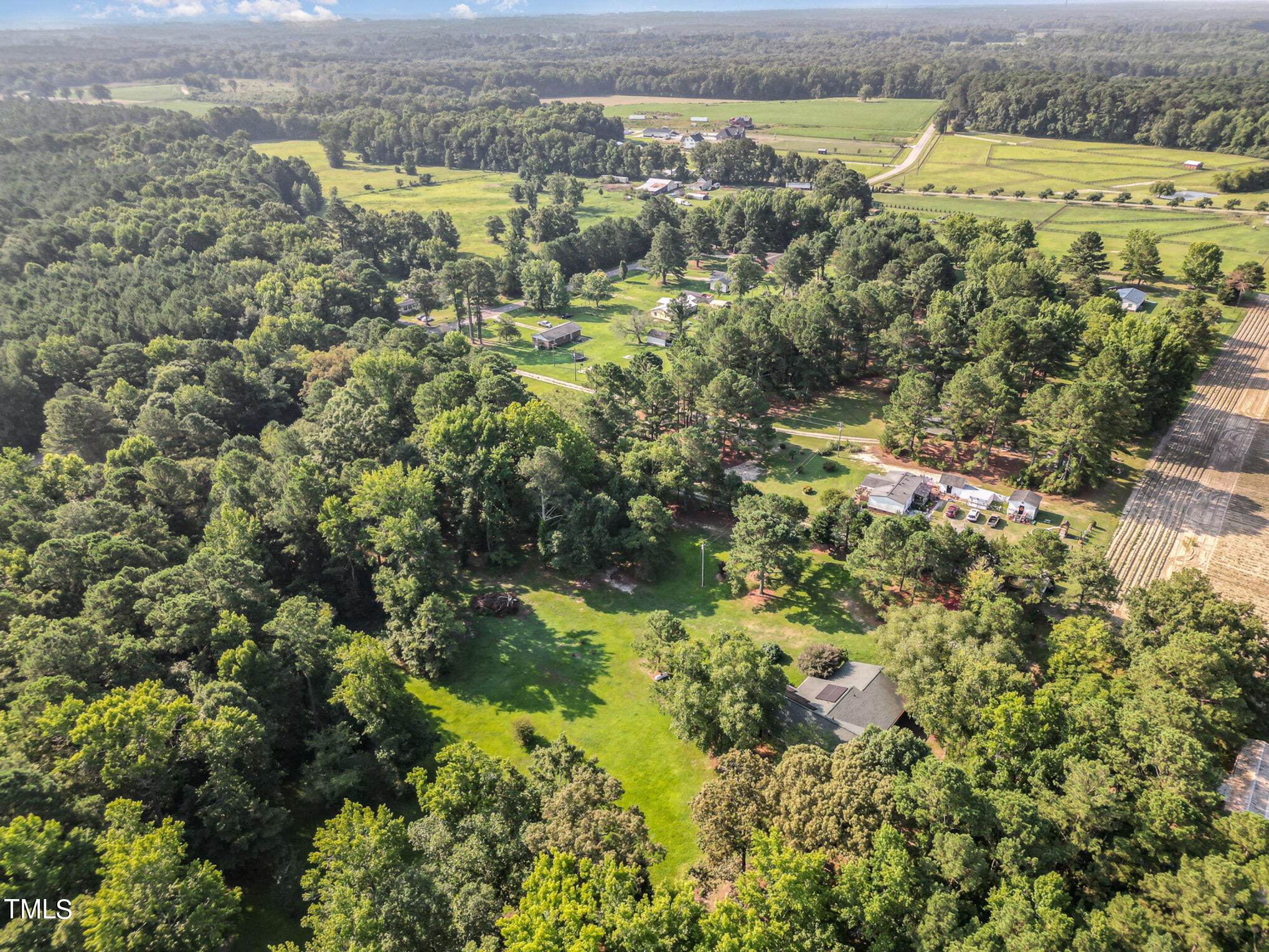 2887 Micro Road West Selma, NC 27576 - Photo 48 of 48 an aerial view of residential houses with outdoor space and trees