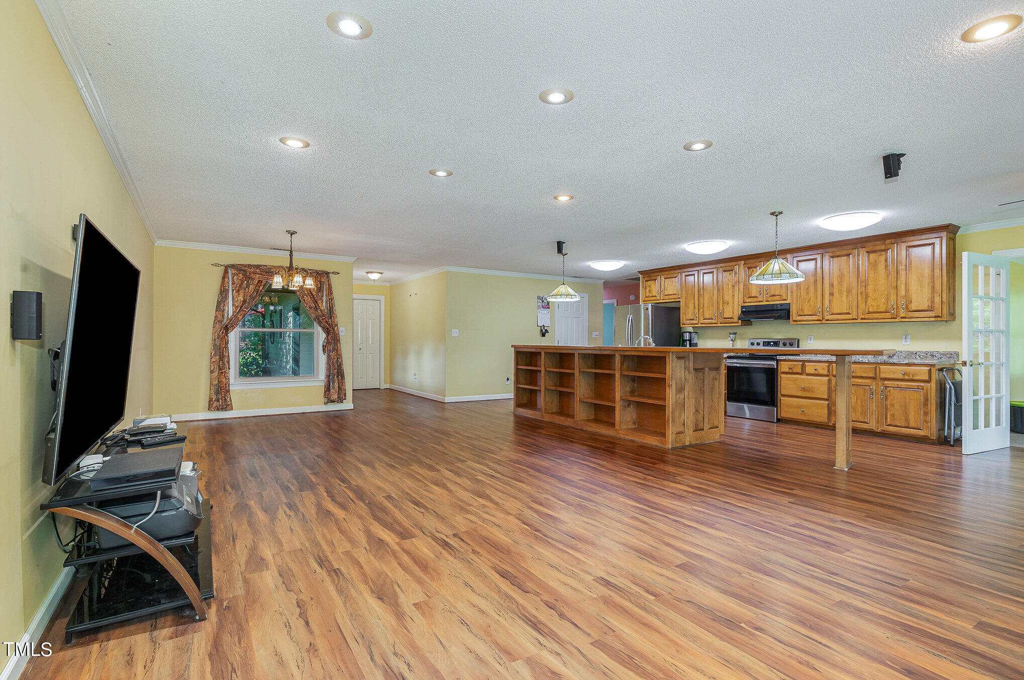 2887 Micro Road West Selma, NC 27576 - Photo 8 of 48 a room with wooden floors and lots of furniture