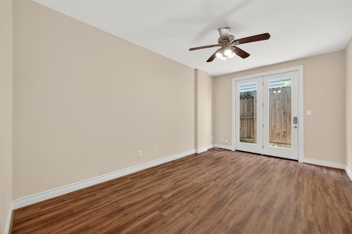 5938 Kansas Street Houston, TX 77007 - Photo 15 of 30 a view of empty room with wooden floor