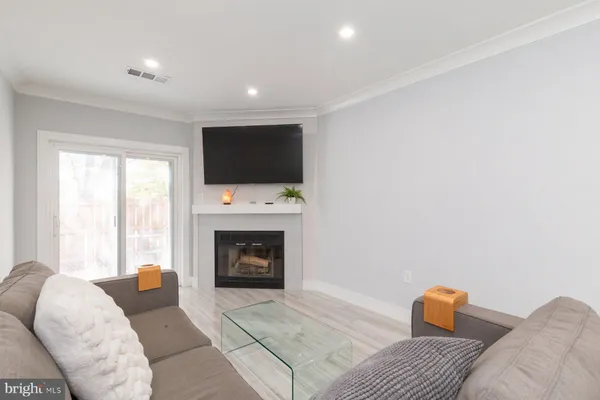 a bedroom with furniture and a fireplace