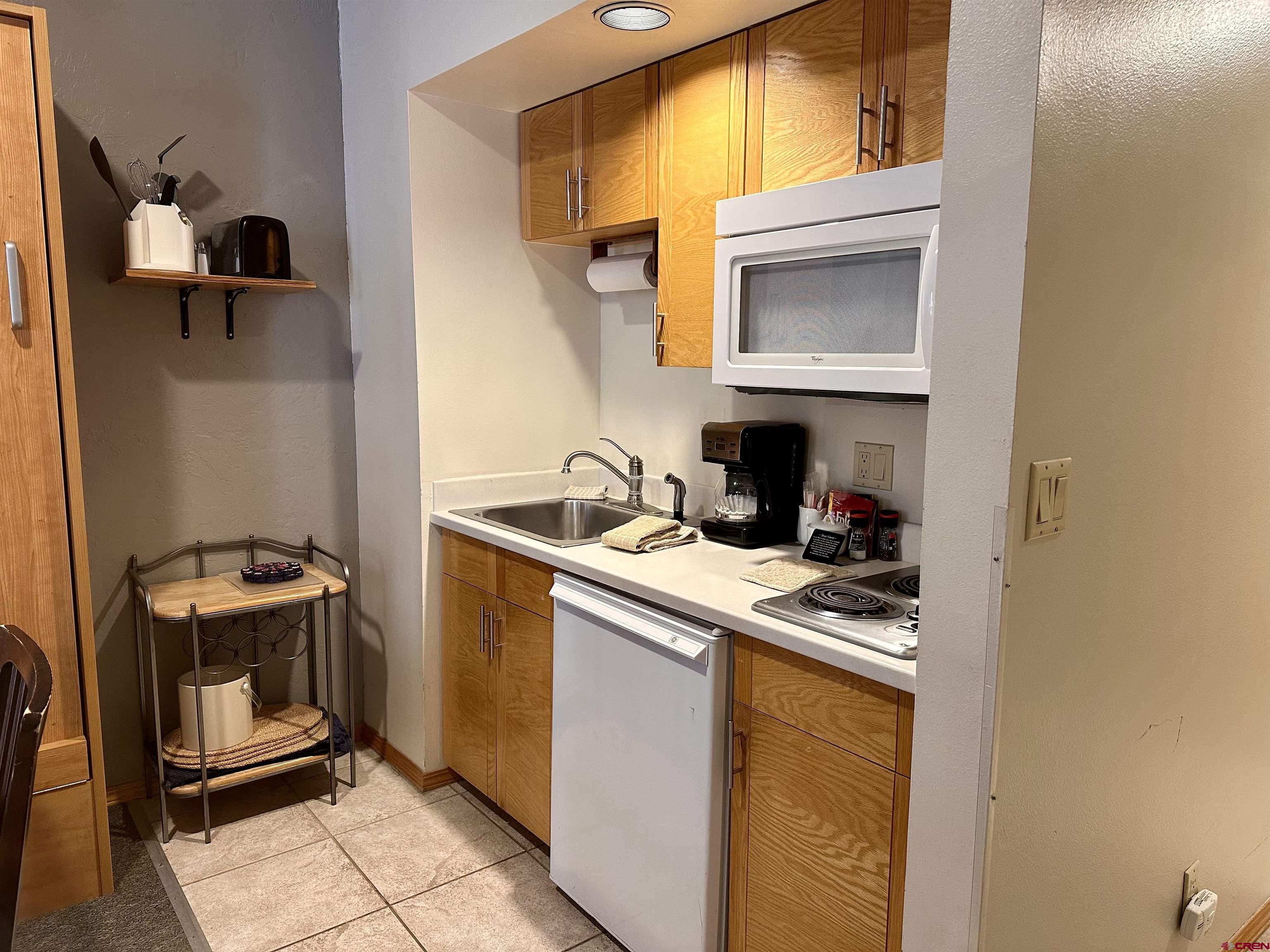71 Needles Way, Unit 441 Durango, CO 81301 - Photo 11 of 39 a kitchen with a stove and a sink