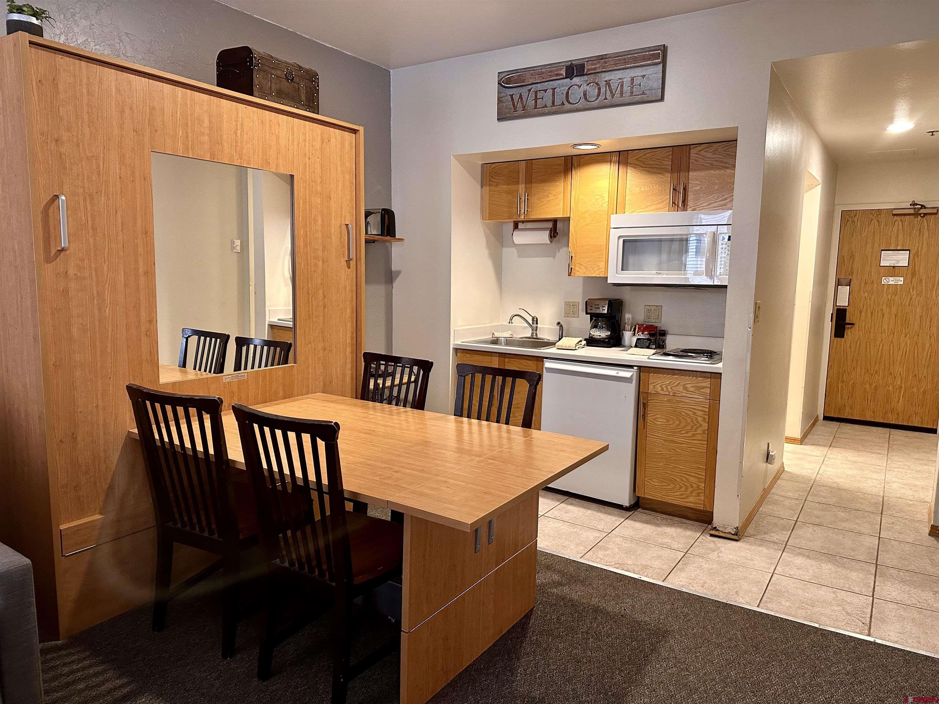 71 Needles Way, Unit 441 Durango, CO 81301 - Photo 6 of 39 a kitchen with stainless steel appliances granite countertop a stove a sink and a refrigerator