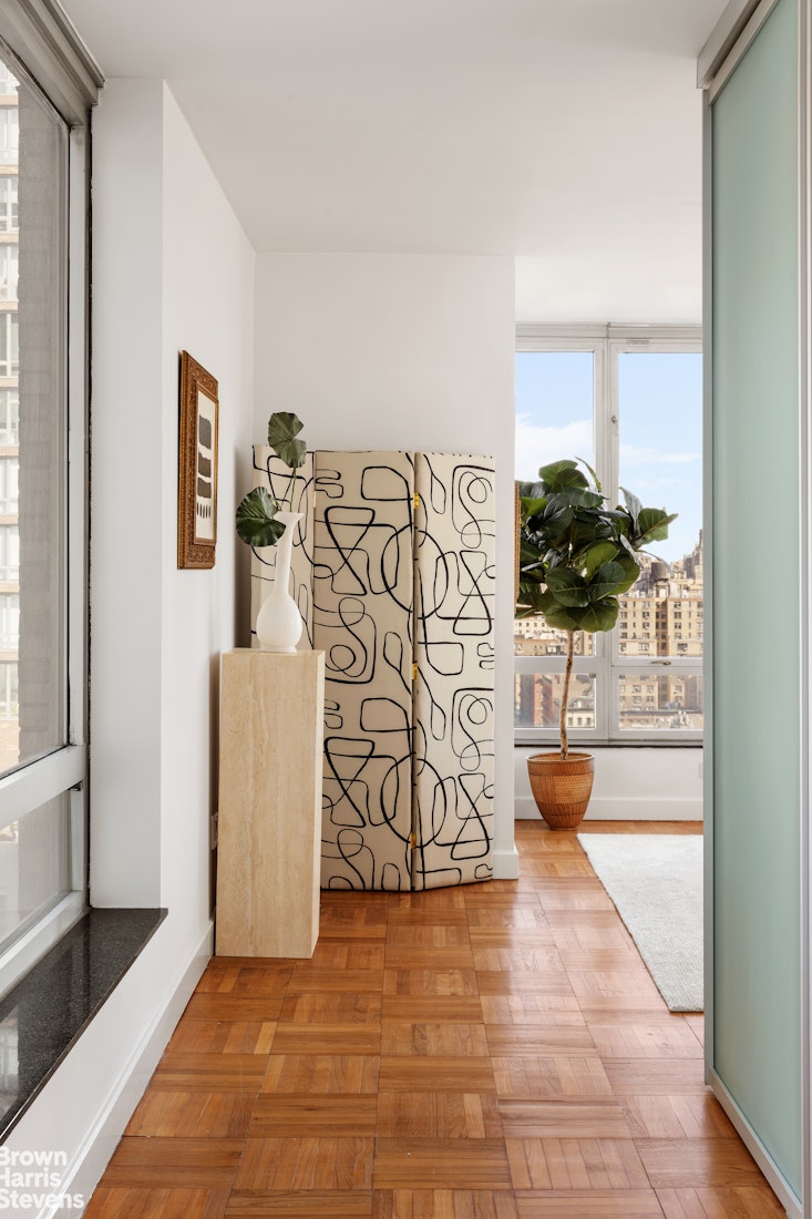 150 Columbus Avenue, Unit 18F Manhattan, NY 10023 - Photo 10 of 22 a view of an entryway with wooden floor