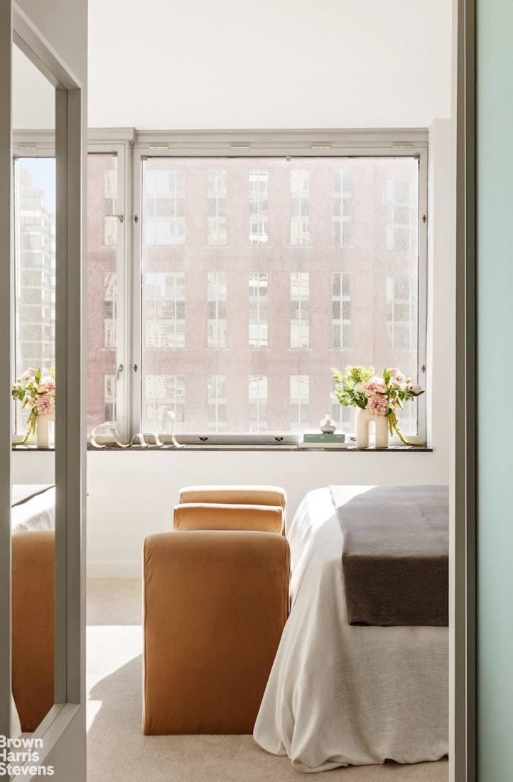 150 Columbus Avenue, Unit 18F Manhattan, NY 10023 - Photo 17 of 22 a white bath tub sitting in front of a window