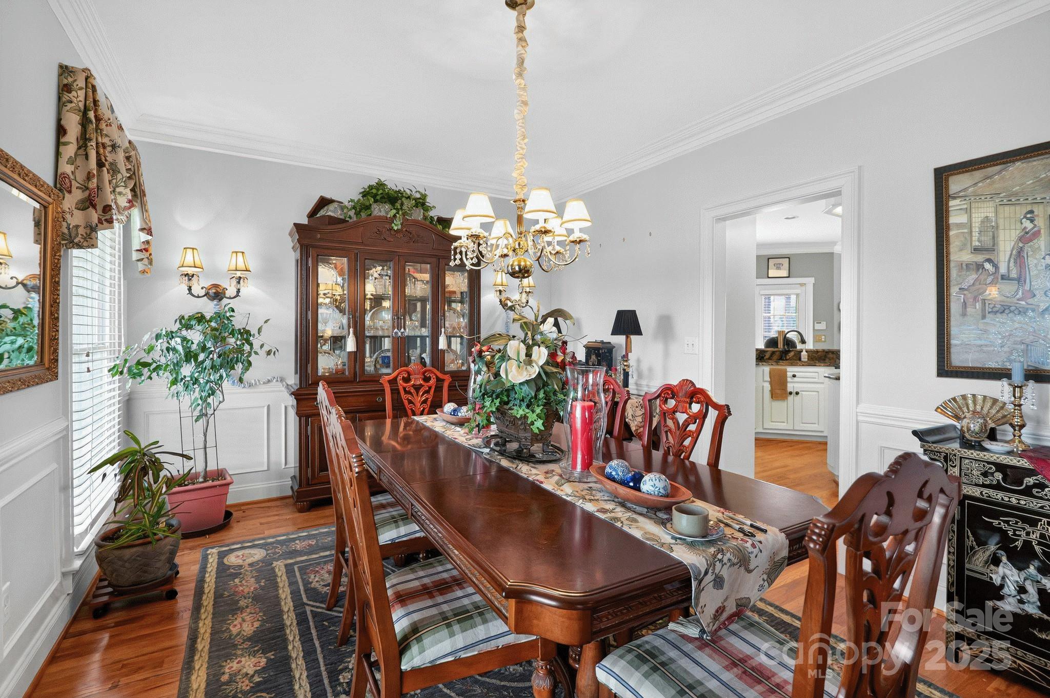 1004 Brockman Road Greer, SC 29651 - Photo 12 of 46 a view of a dining room with furniture and chandelier
