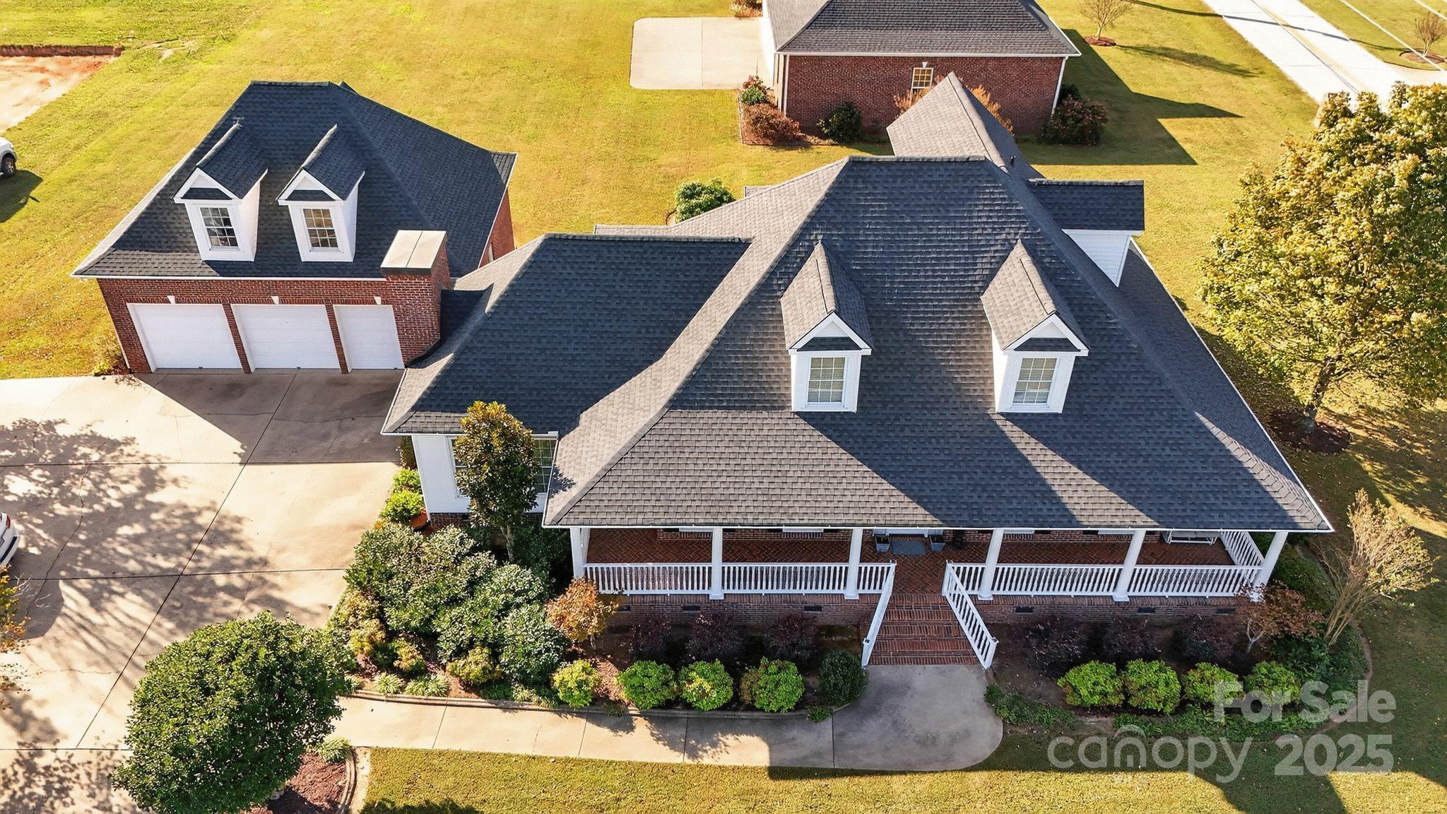 1004 Brockman Road Greer, SC 29651 - Photo 2 of 46 a aerial view of a house with a yard and potted plants