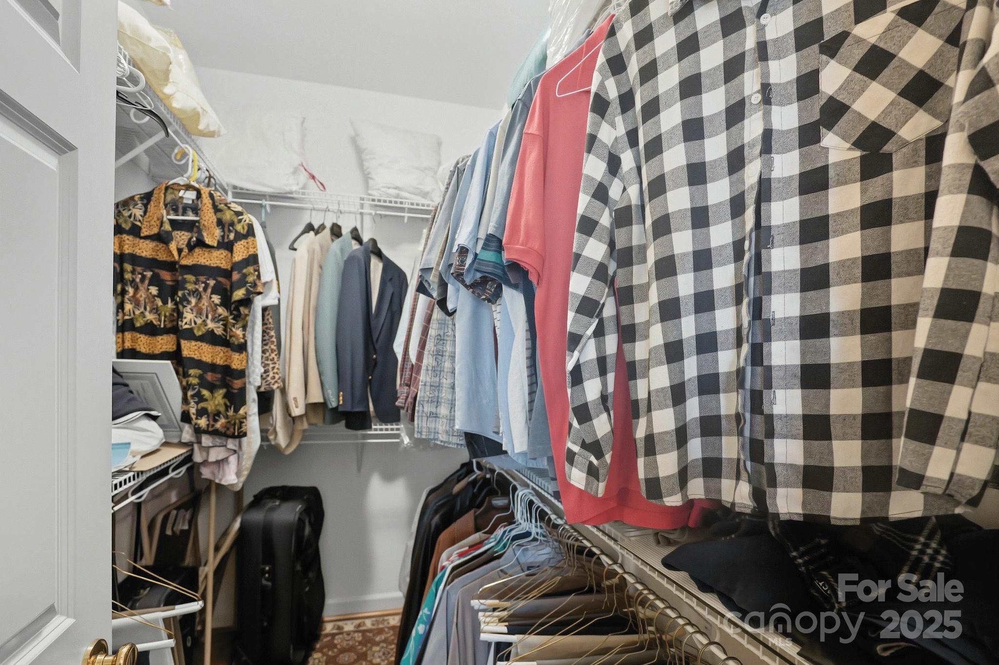 1004 Brockman Road Greer, SC 29651 - Photo 22 of 46 a view of walk in closet with clothes and shoes