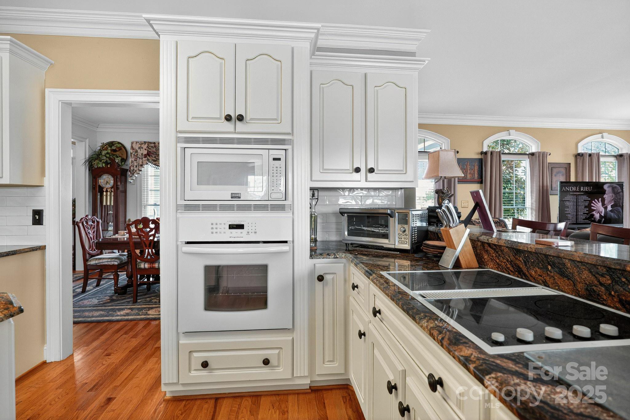 1004 Brockman Road Greer, SC 29651 - Photo 6 of 46 a kitchen with stainless steel appliances granite countertop a stove a sink and a microwave
