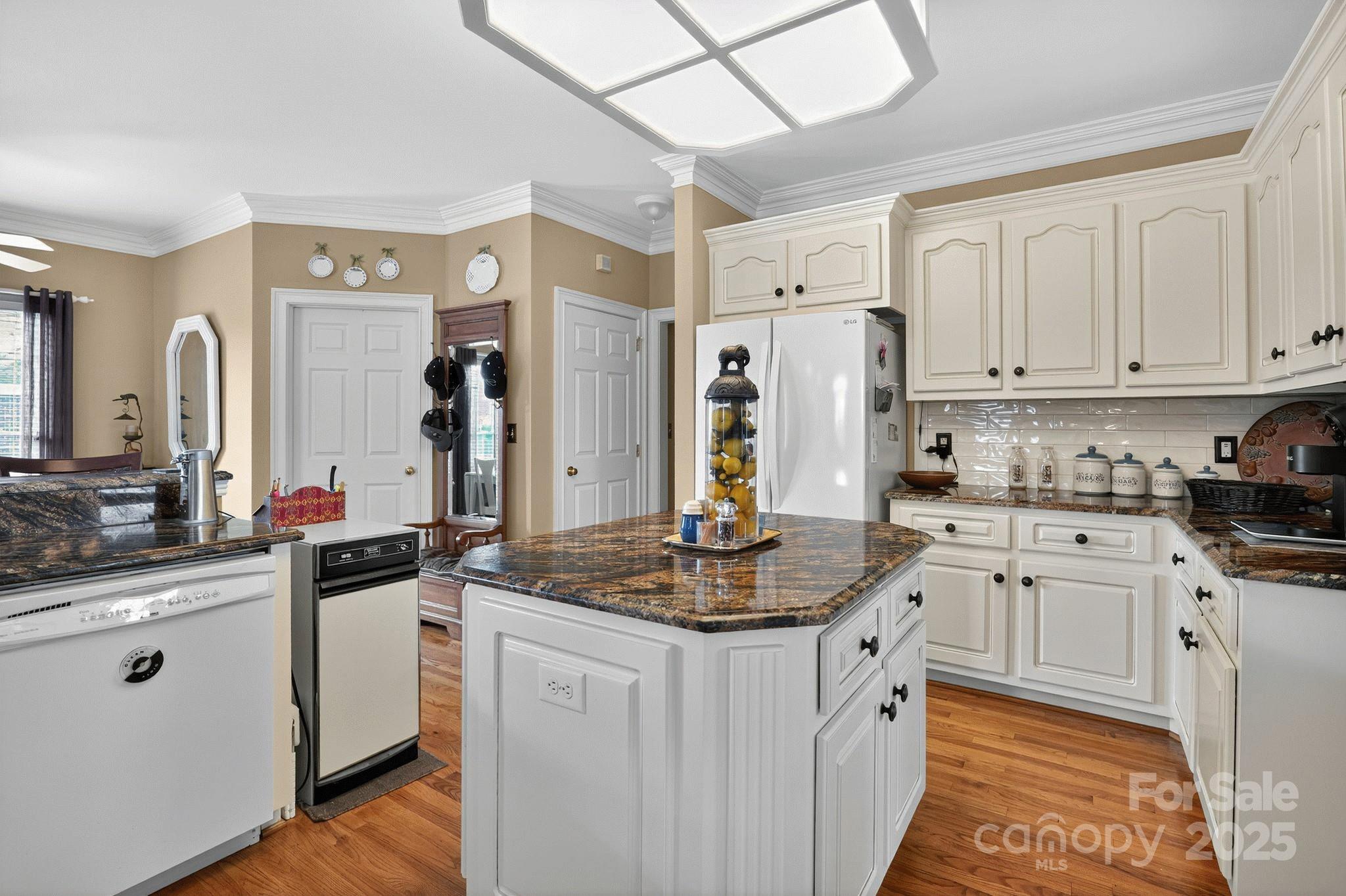 1004 Brockman Road Greer, SC 29651 - Photo 7 of 46 a kitchen with white cabinets and appliances