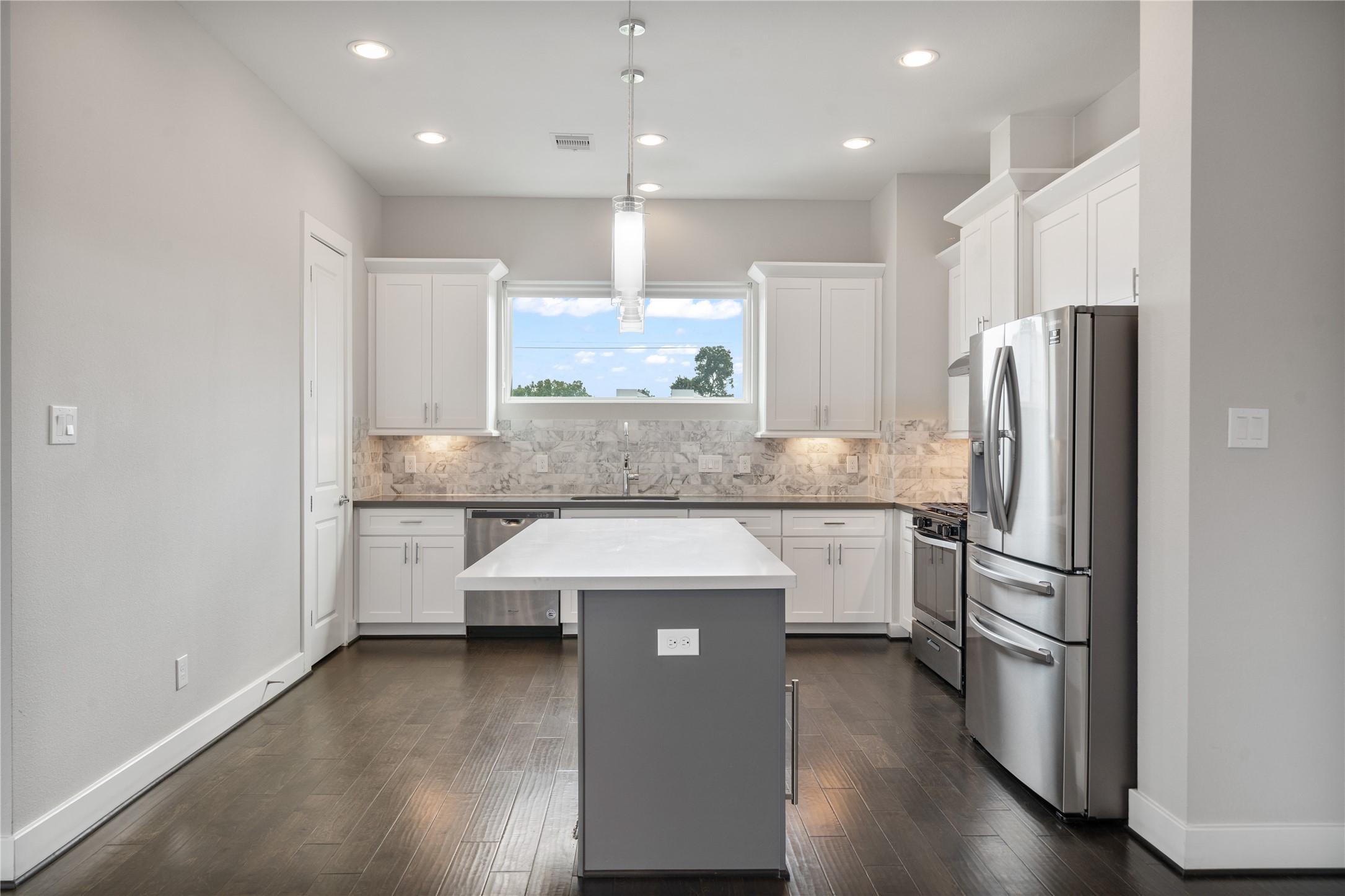 2510 Tuam Street, Unit G Houston, TX 77004 - Photo 20 of 40 a kitchen with stainless steel appliances granite countertop a refrigerator a sink and a stove