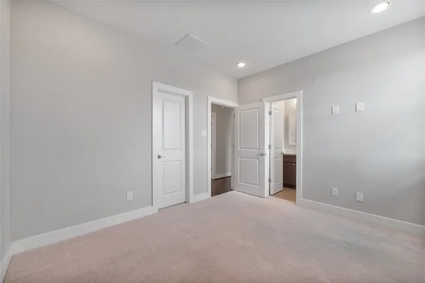 a bathroom with a granite countertop sink a toilet and shower