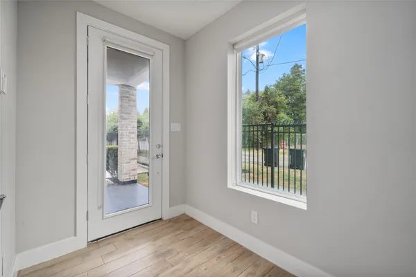 a view of entryway with wooden floor