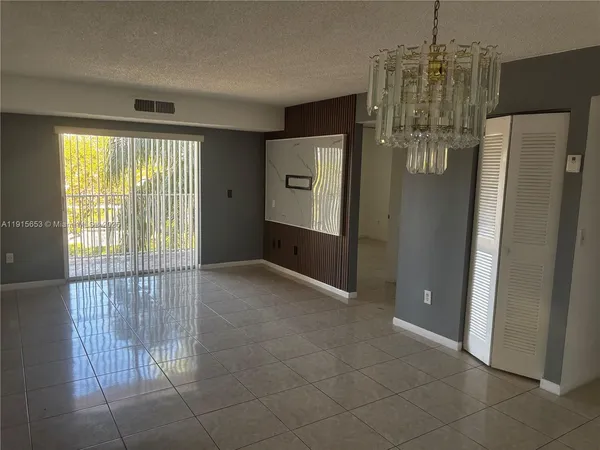 a view of a hallway with windows