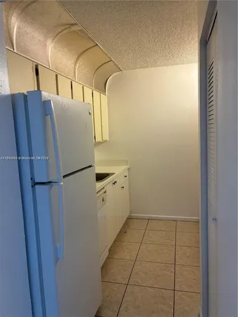 a utility room with cabinets