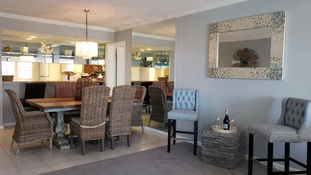 a dining room with furniture and window