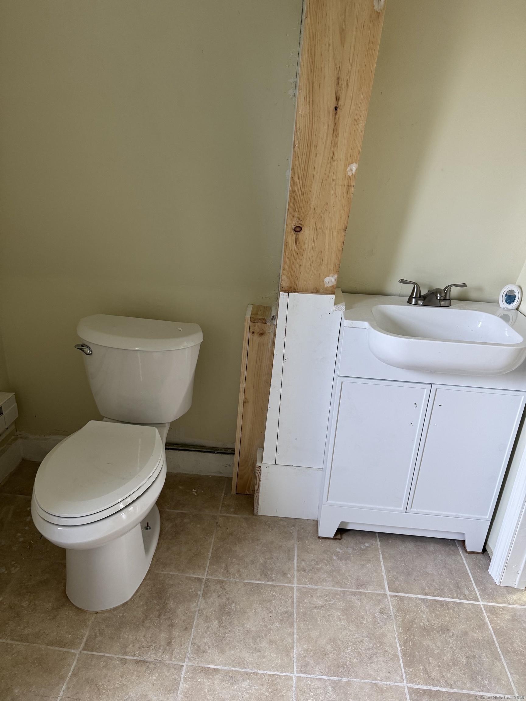 52 Pearl Street, Unit 3 New Haven, CT 06511 - Photo 11 of 12 a bathroom with a toilet sink and mirror