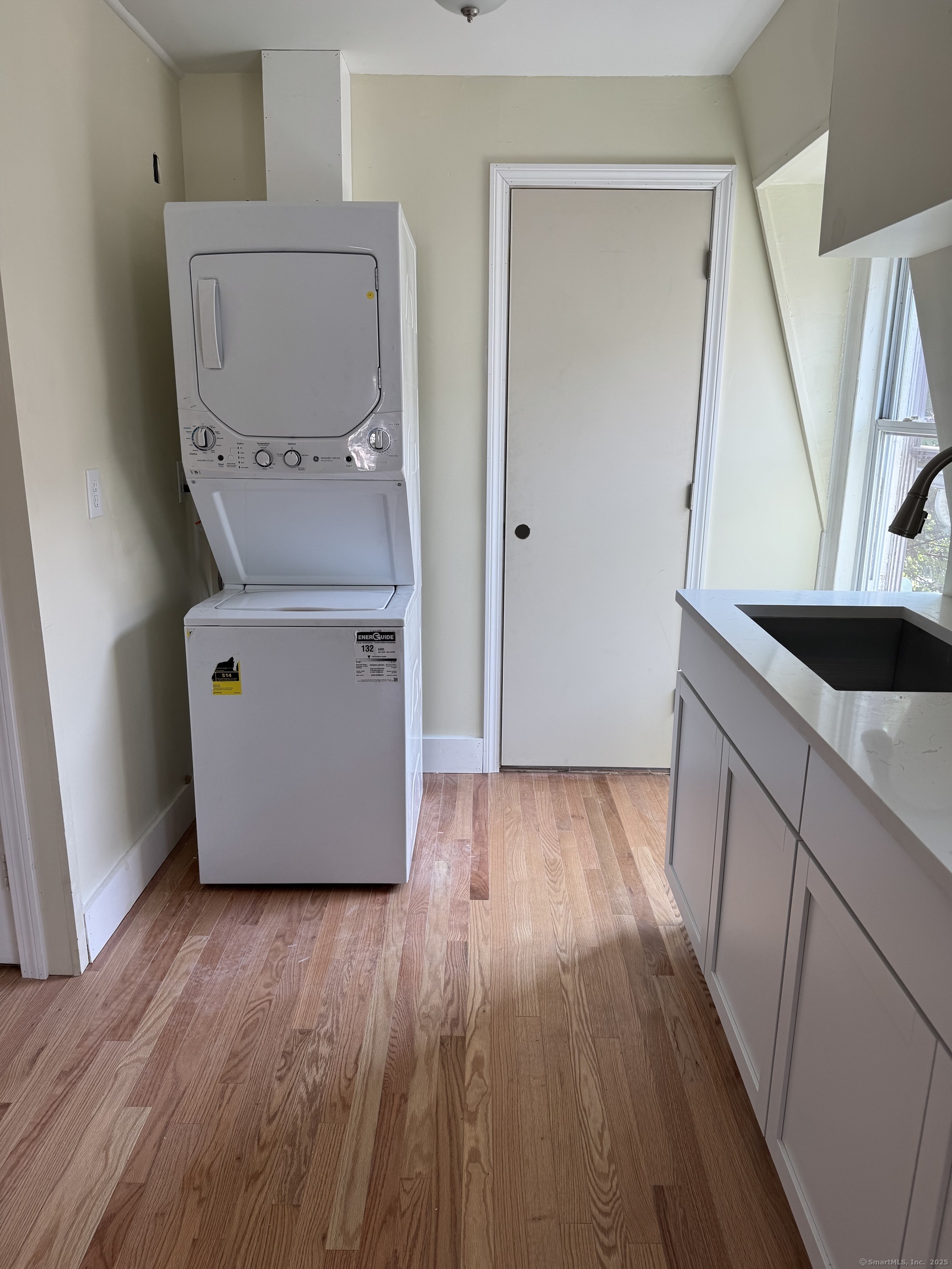 52 Pearl Street, Unit 3 New Haven, CT 06511 - Photo 5 of 12 a utility room with wooden floor washer and dryer