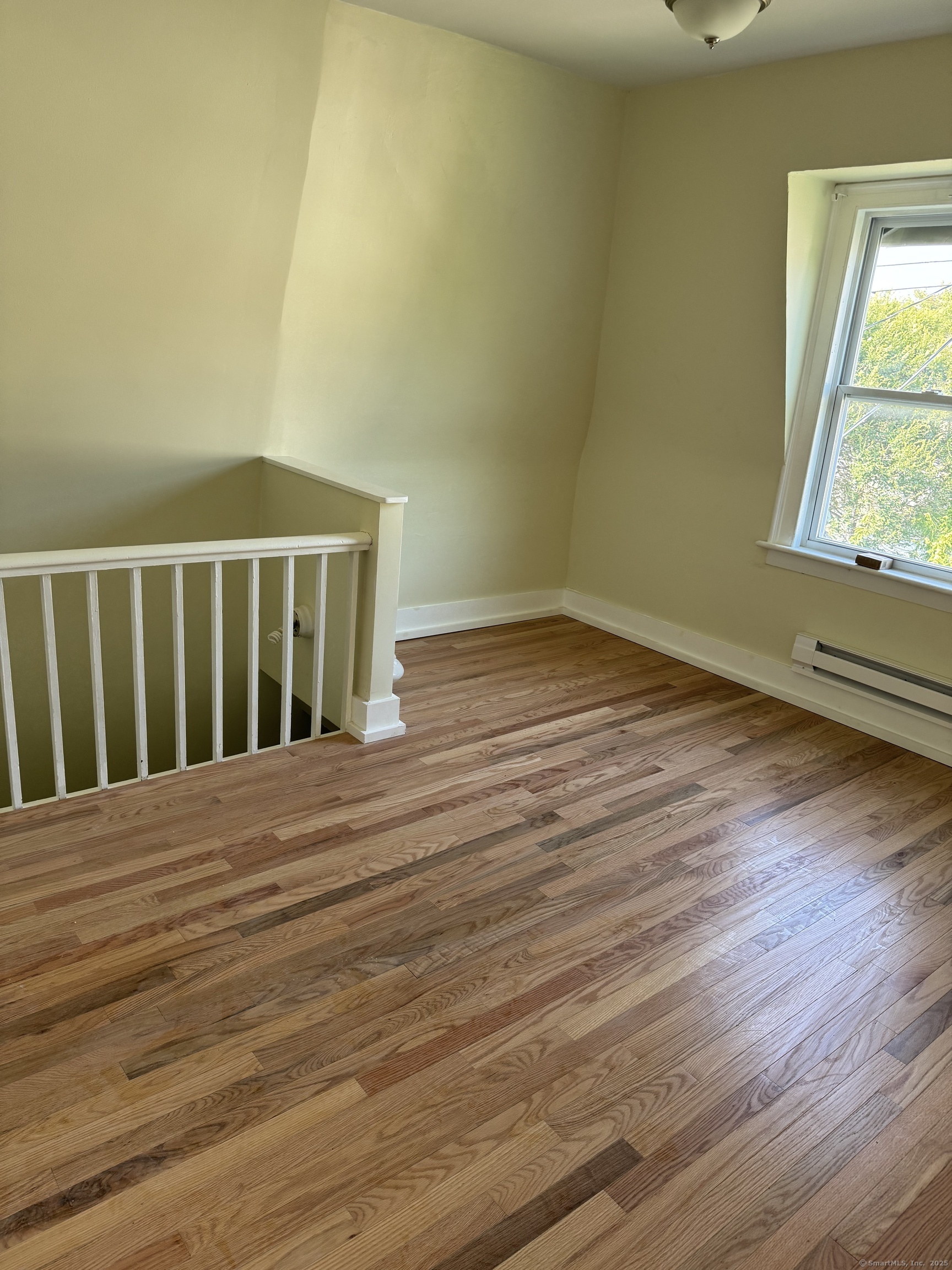 52 Pearl Street, Unit 3 New Haven, CT 06511 - Photo 7 of 12 a view of wooden floor and brick walls