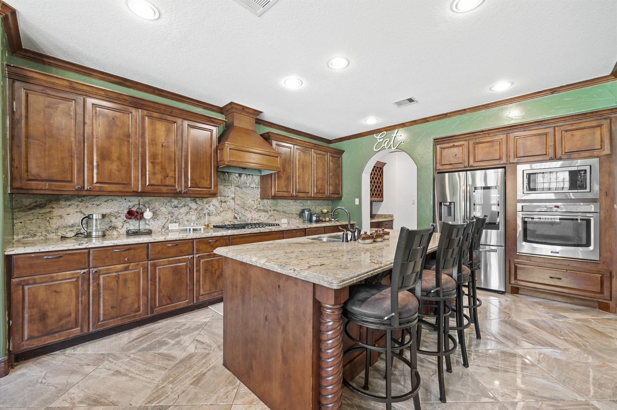 826 Oak Bend Loop Cleveland, TX 77328 - Photo 13 of 50 a kitchen with granite countertop a sink and cabinets