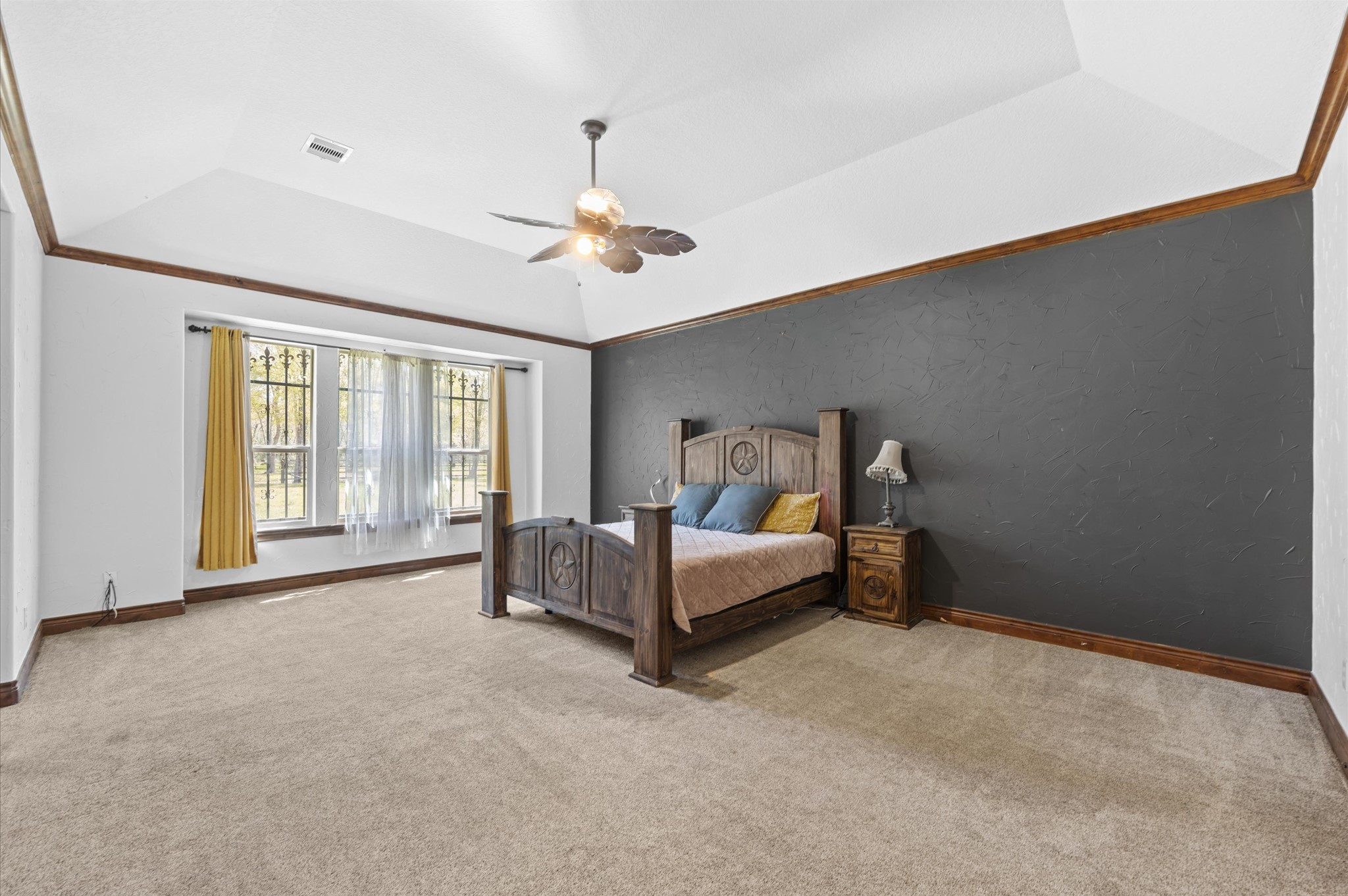 826 Oak Bend Loop Cleveland, TX 77328 - Photo 15 of 50 a spacious bedroom with a bed and a chandelier