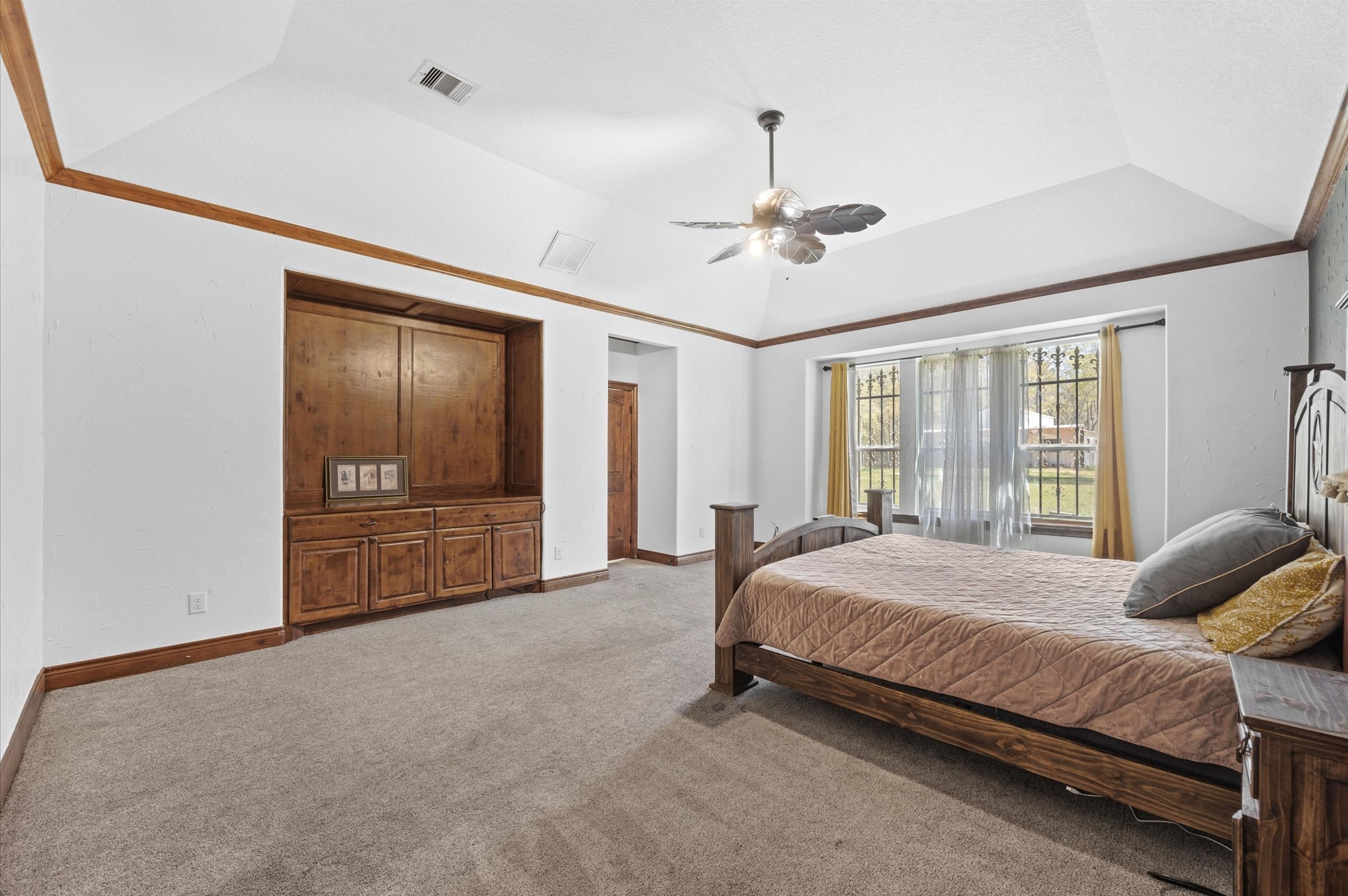 826 Oak Bend Loop Cleveland, TX 77328 - Photo 16 of 50 a spacious bedroom with a bed and a chandelier
