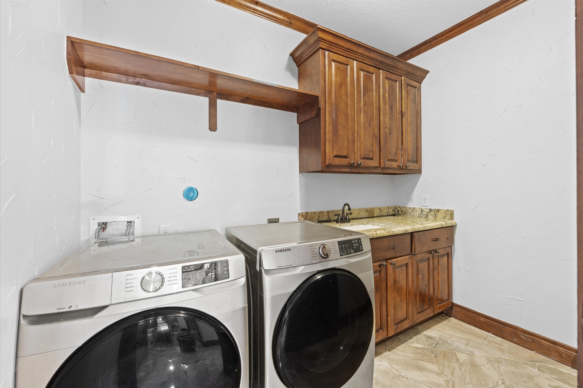 826 Oak Bend Loop Cleveland, TX 77328 - Photo 19 of 50 a utility room with dryer and washer