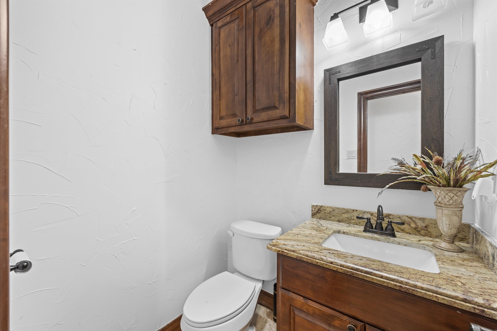 826 Oak Bend Loop Cleveland, TX 77328 - Photo 20 of 50 a bathroom with a granite countertop toilet sink and mirror