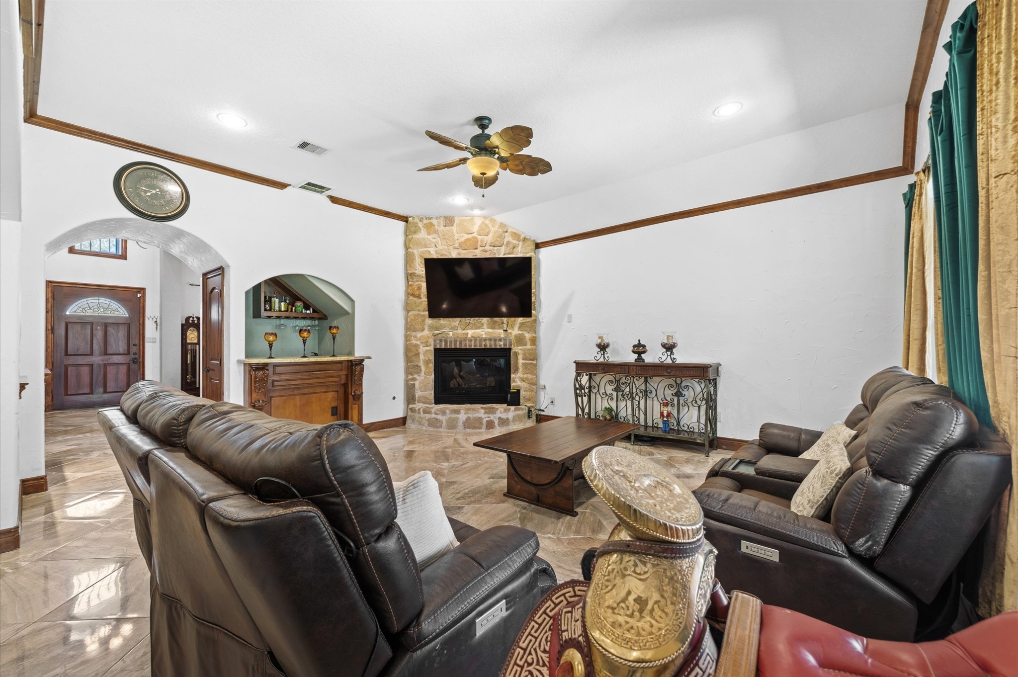 826 Oak Bend Loop Cleveland, TX 77328 - Photo 6 of 50 a living room with furniture a fireplace and a flat screen tv