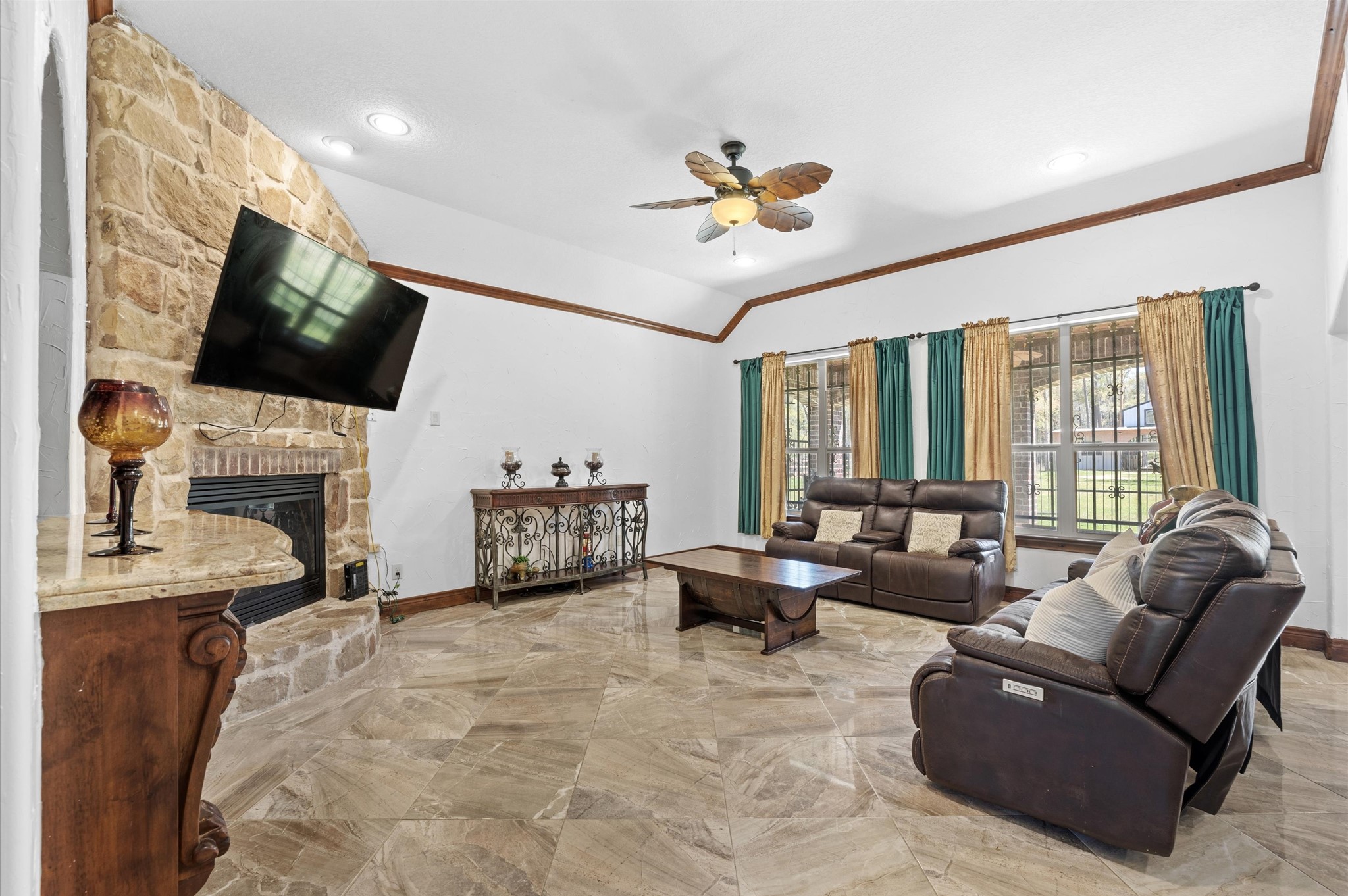 826 Oak Bend Loop Cleveland, TX 77328 - Photo 7 of 50 a living room with furniture fireplace and a flat screen tv