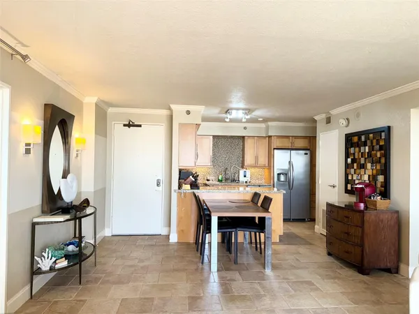 a kitchen with a refrigerator and a sink