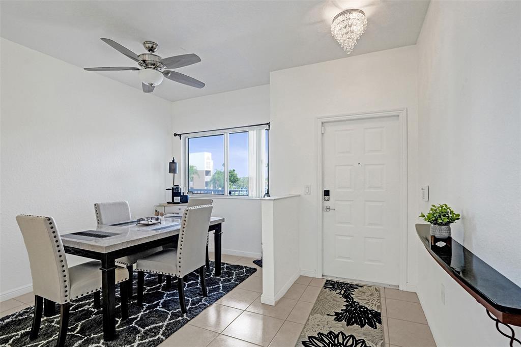 7623 Southampton Terrace, Unit 302 Tamarac, FL 33321 - Photo 1 of 43 a view of a dining room with furniture and a potted plant