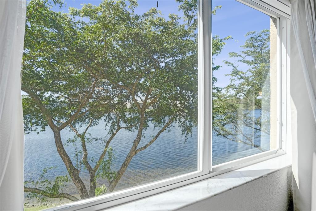7623 Southampton Terrace, Unit 302 Tamarac, FL 33321 - Photo 19 of 43 a view of a tree in a window