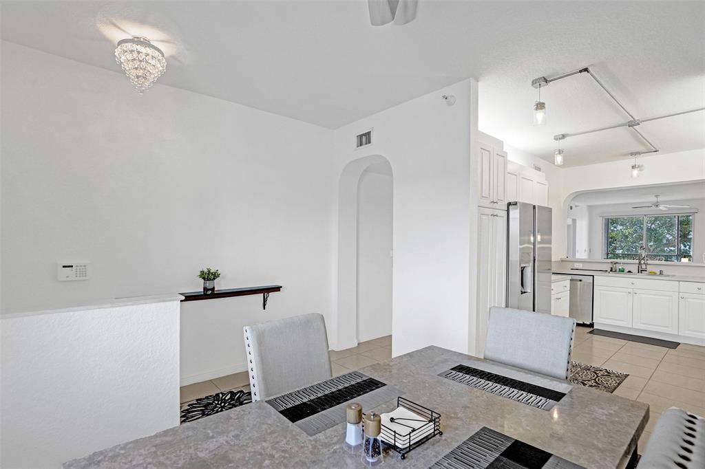 7623 Southampton Terrace, Unit 302 Tamarac, FL 33321 - Photo 2 of 43 a living room with a couch and a window