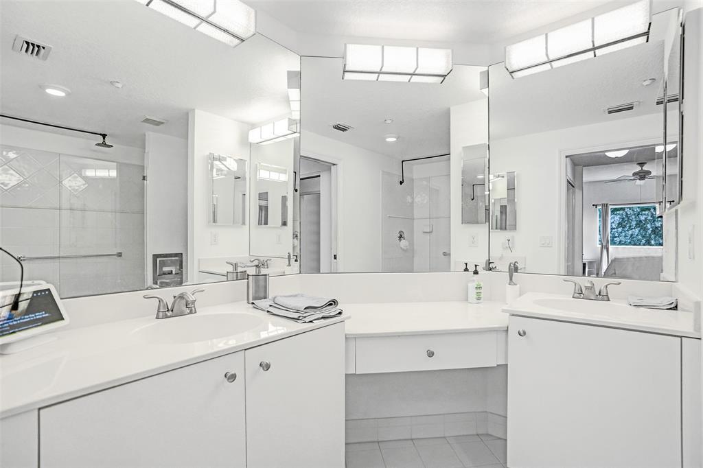 7623 Southampton Terrace, Unit 302 Tamarac, FL 33321 - Photo 23 of 43 a bathroom with a double vanity sink mirror and double