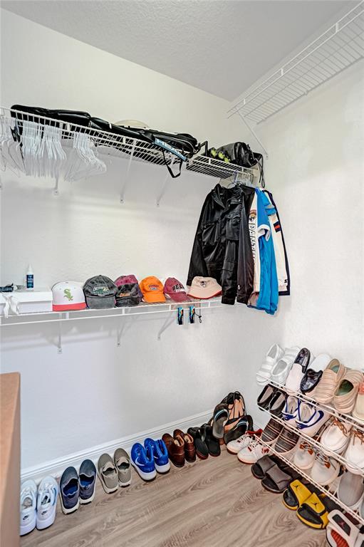 7623 Southampton Terrace, Unit 302 Tamarac, FL 33321 - Photo 27 of 43 a view of walk in closet with clothes and shoes