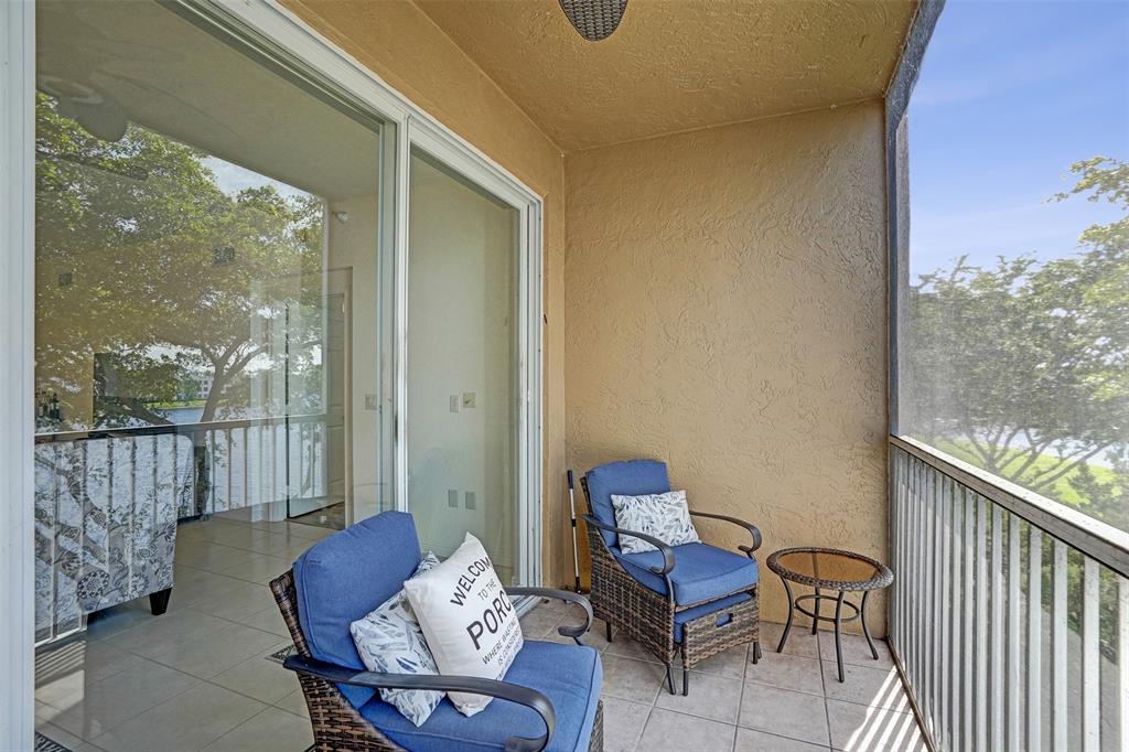 7623 Southampton Terrace, Unit 302 Tamarac, FL 33321 - Photo 29 of 43 a outdoor living space with furniture and a floor to ceiling window