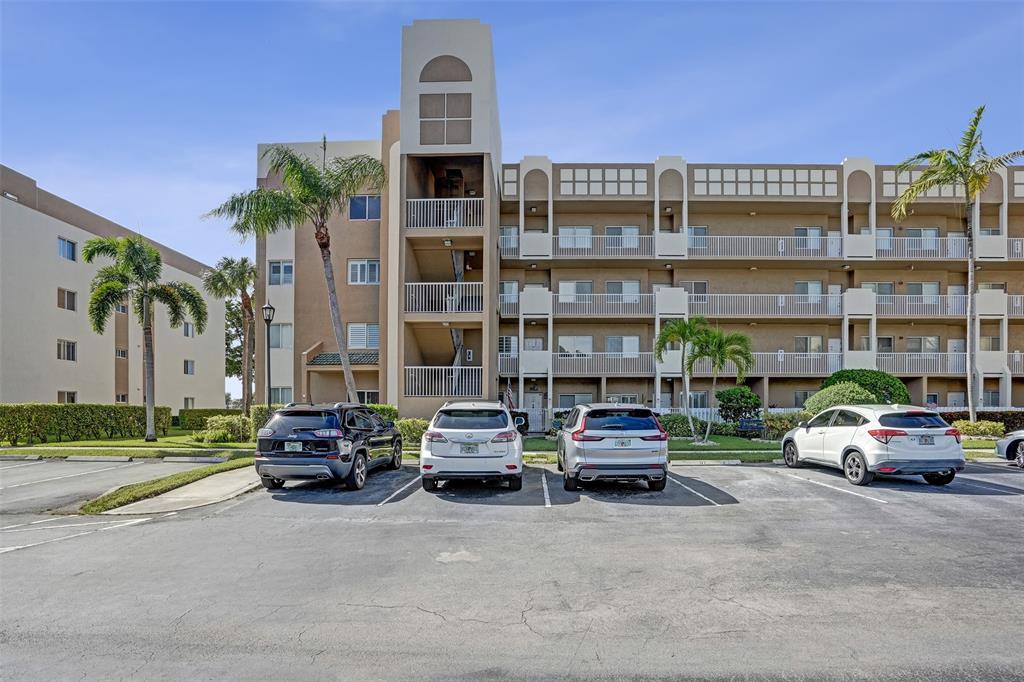7623 Southampton Terrace, Unit 302 Tamarac, FL 33321 - Photo 33 of 43 a cars parked in front of a building