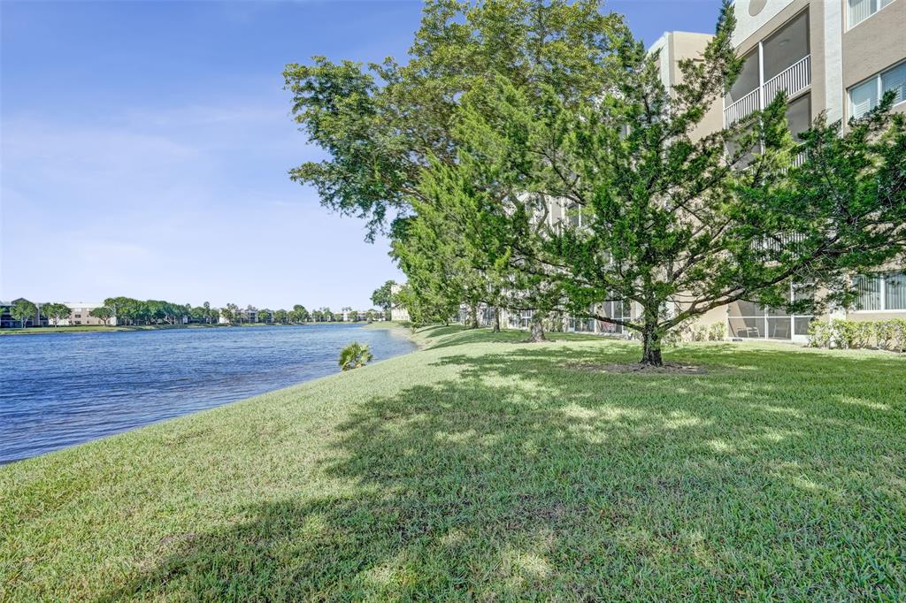 7623 Southampton Terrace, Unit 302 Tamarac, FL 33321 - Photo 34 of 43 a view of lake with green field