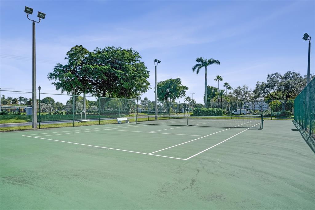 7623 Southampton Terrace, Unit 302 Tamarac, FL 33321 - Photo 35 of 43 a view of a tennis court