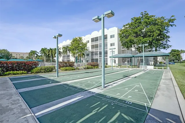 a view of swimming pool with outdoor seating and plants