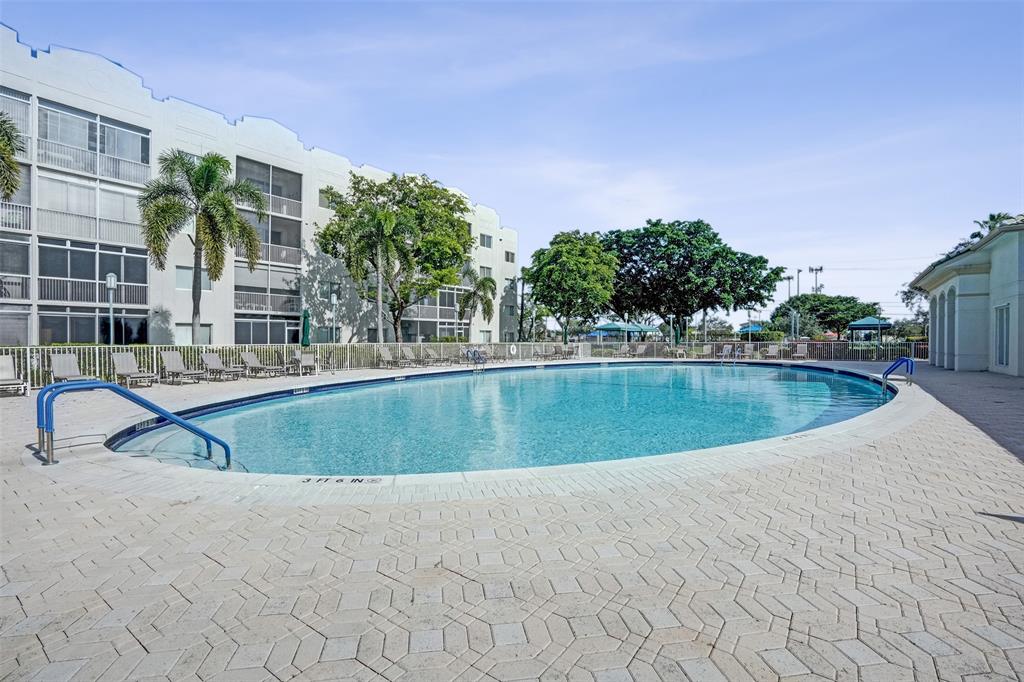 7623 Southampton Terrace, Unit 302 Tamarac, FL 33321 - Photo 39 of 43 a view of swimming pool with outdoor seating and plants