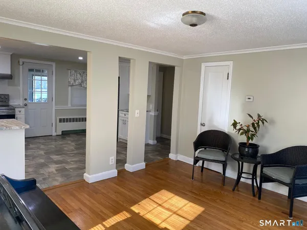 a living room with furniture and a rug