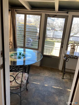 a view of a room with furniture and a window