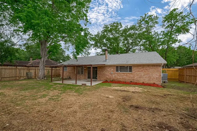 a house that has a tree in front of it