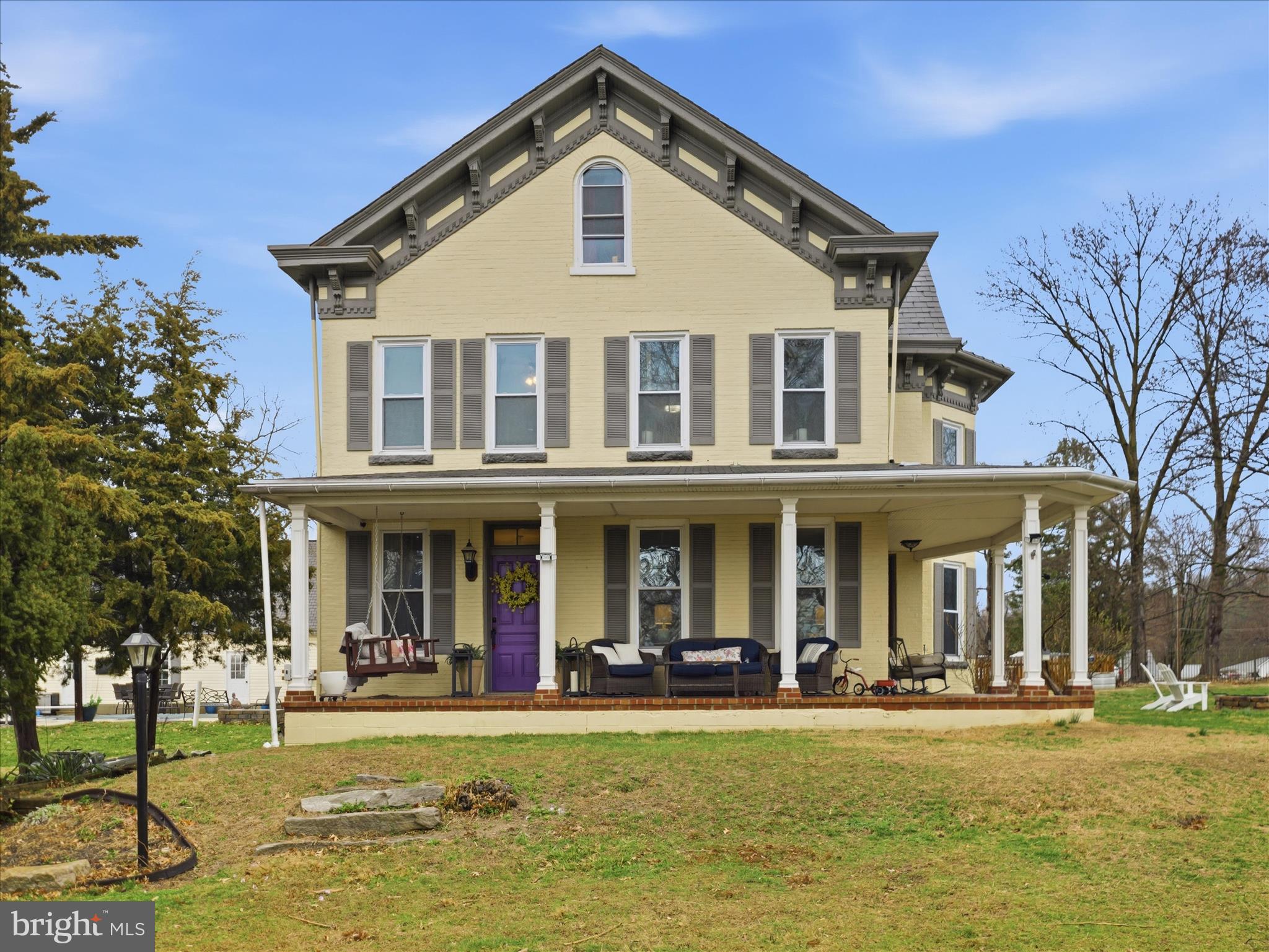 a front view of a building with a garden
