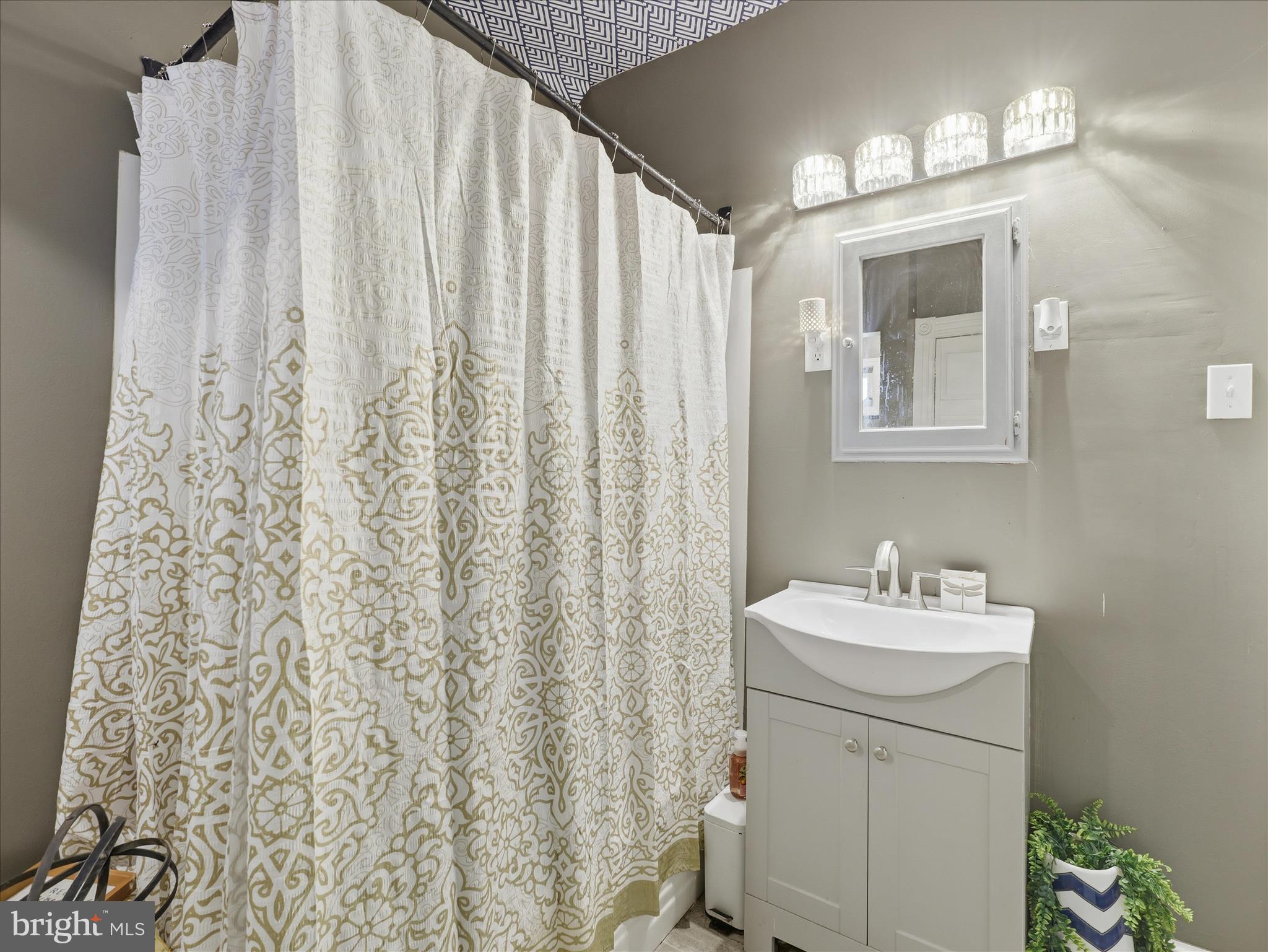 14147 Lower Edgemont Road Waynesboro, PA 17268 - Photo 12 of 45 a bathroom with a sink a toilet and a mirror