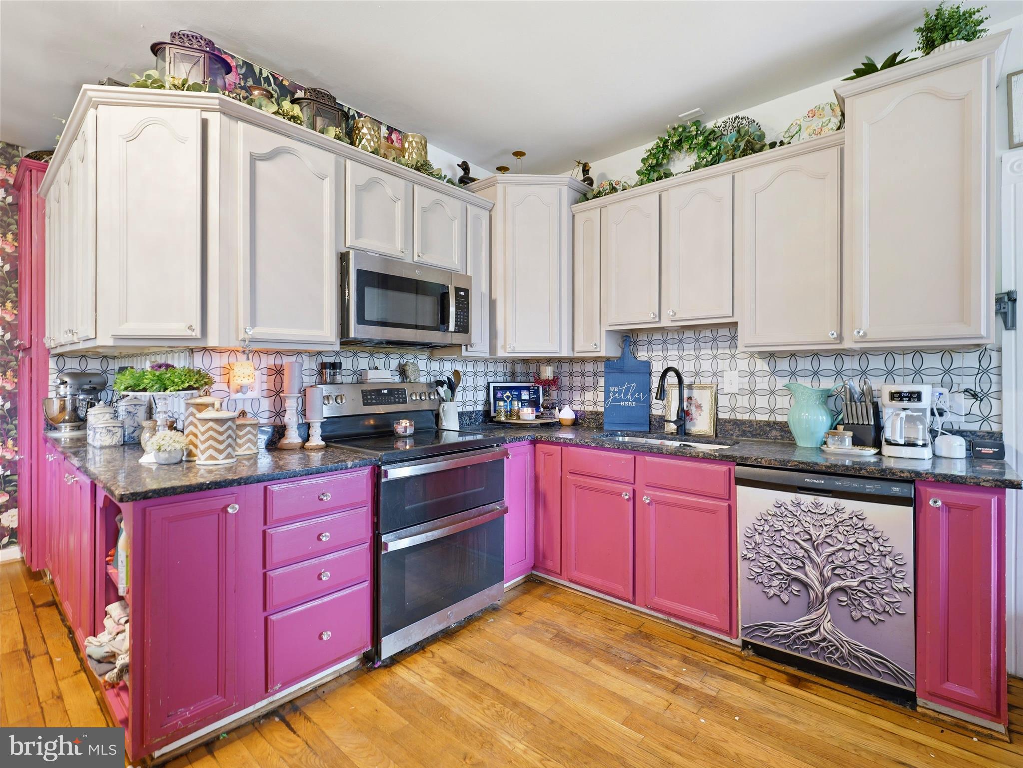 14147 Lower Edgemont Road Waynesboro, PA 17268 - Photo 14 of 45 a kitchen with stainless steel appliances granite countertop a stove sink microwave and cabinets