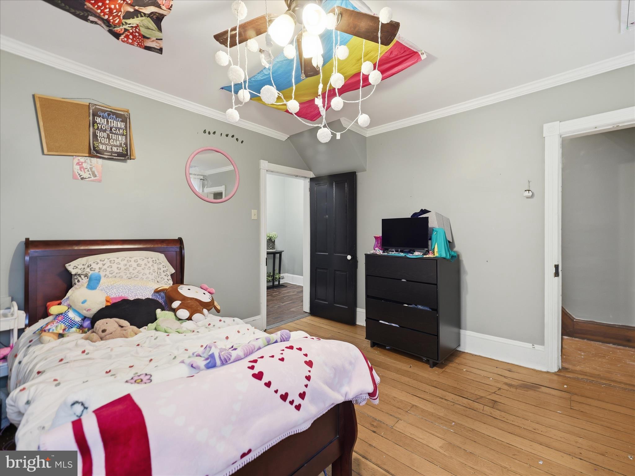 14147 Lower Edgemont Road Waynesboro, PA 17268 - Photo 29 of 45 a bedroom with a bed and wooden floor