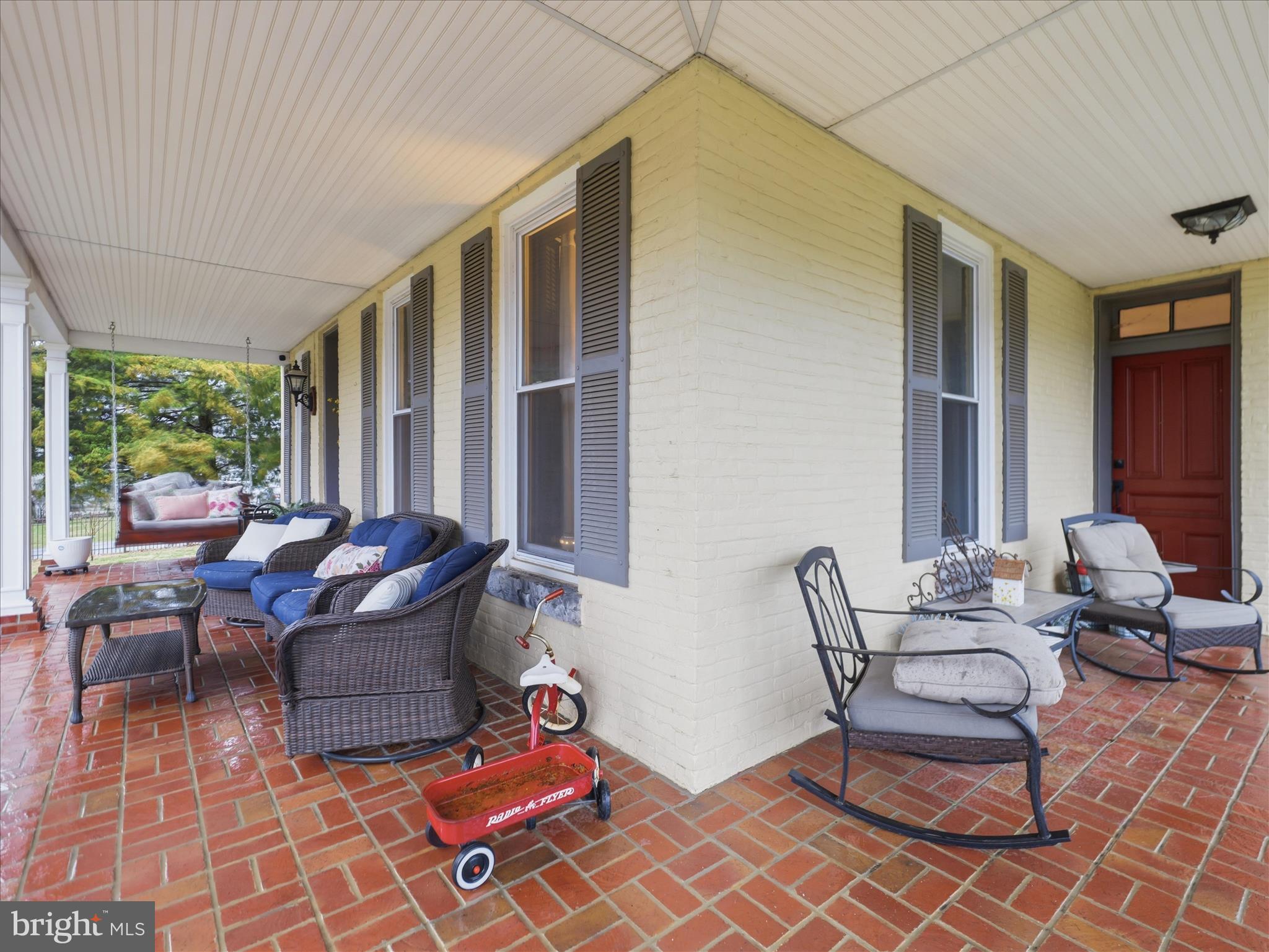 14147 Lower Edgemont Road Waynesboro, PA 17268 - Photo 39 of 45 a living room with patio furniture and floor to ceiling windows