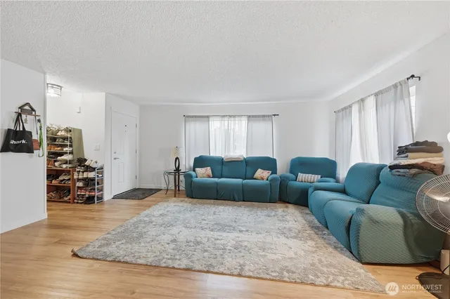 a kitchen with sink cabinets and wooden floor